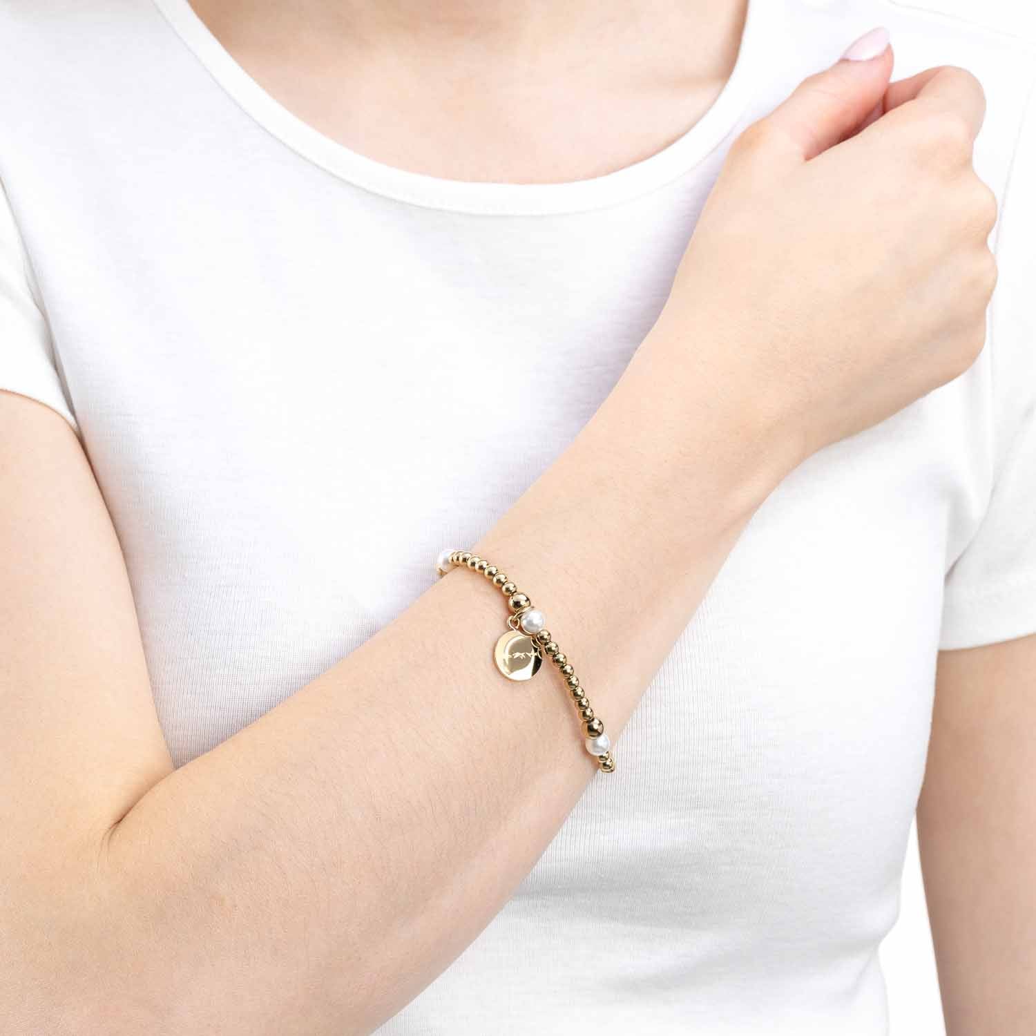 leonardo-mathilde-bracelet-perles-blanches-lastique-dor image 2